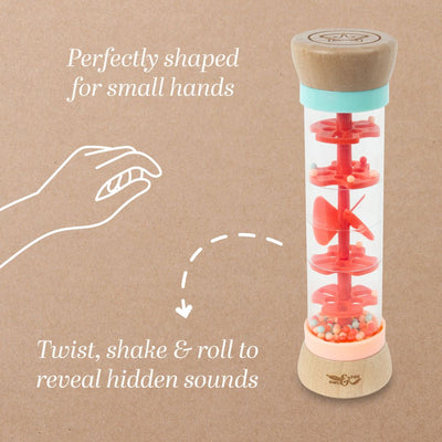 The TP Toys Owl & Fox Wooden Rainmaker - FSC® certified features an hourglass shape with red discs and beads inside, designed for little hands to twist, shake, and roll—perfect for sensory development through varied sounds.