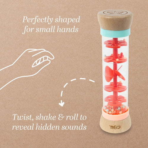 The TP Toys Owl & Fox Wooden Rainmaker - FSC® certified features an hourglass shape with red discs and beads inside, designed for little hands to twist, shake, and roll—perfect for sensory development through varied sounds.