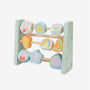 The Grow With Peppa Pig Wooden Abacus by TP Toys features three horizontal rods with spinning blocks displaying colorful images of animals, shapes, and weather symbols—perfect for sensory play and supporting fine motor skill development.