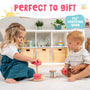 Two young children play with the TP Toys Grow with Peppa Pig Wooden Roller Rattle and Topple Tower Set on the floor of a bright room with shelves and baskets. Perfect to gift and made from FSC certified wood.