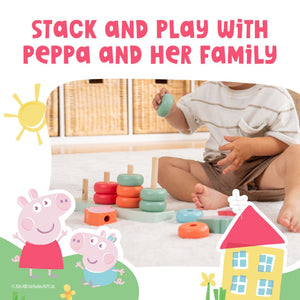 A young child stacks colorful rings on the Grow with Peppa Pig Wooden Family Ring Stacker by TP Toys, surrounded by playful house and sun designs, building fine motor skills during fun-filled play.