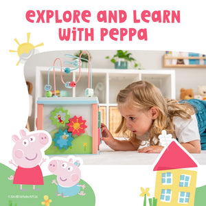 A young girl enjoys sensory exploration with the TP Toys Grow with Peppa Pig Wooden Activity Cube, featuring Peppa Pig graphics and the text "Explore and Learn with Peppa.