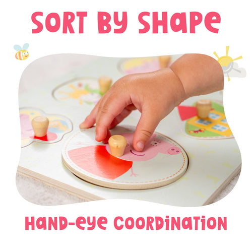 A child's hand places a round cartoon Peppa Pig piece into the Grow with Peppa Pig Wooden Puzzle Set by TP Toys, building fine motor skills and hand-eye coordination through shape sorting.