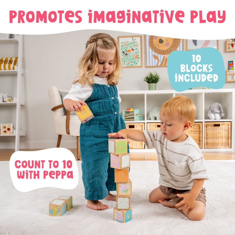 Two young children play in a playroom with the Grow with Peppa Pig 10 Piece Wooden Block Set by TP Toys. Text on the image reads: Promotes Imaginative Play, 10 Blocks Included, and Count to 10 with Peppa.