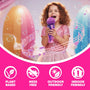 A young girl in a pink dress sings into a toy microphone, surrounded by bubbles from her TP Toys The Unspillable Bubbles – Popstar Edition bubble tube, with icons below showcasing its plant-based formula, no-spill design, and suitability for both indoor and outdoor play.
