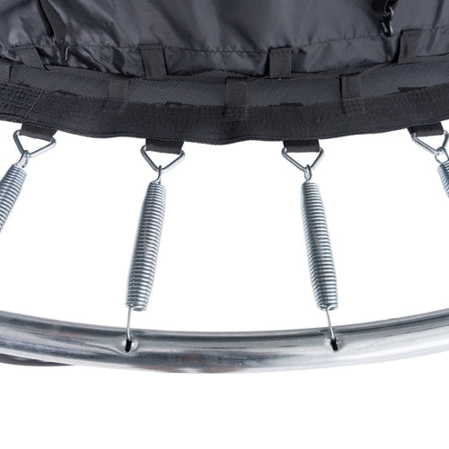 Close-up of TP Toys' TP Genius® 8ft Round Trampoline, showing springs secured to the metal frame and black mat, highlighting a commitment to safety against a white background.