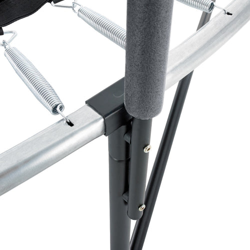 Close-up view of the TP Genius® 8ft Round Trampoline by TP Toys, highlighting metal springs, padded vertical support pole, connecting joints, and parts of the safety enclosure.