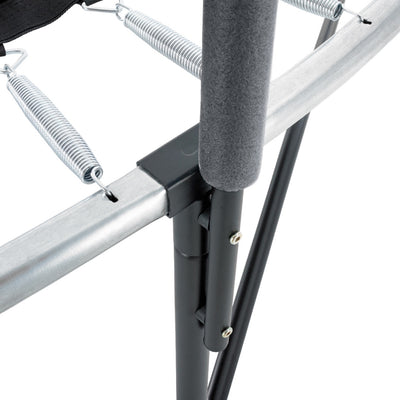 Close-up of the TP Toys TP Genius® 10ft Round Trampoline’s galvanized steel frame, showing metal springs, a padded pole, and bolts connecting the frame and support leg, highlighting its safety enclosure features.