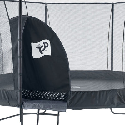 The TP Toys Genius® 12ft Round Trampoline is black with a SurroundSafe enclosure, zippered entrance, white TP logo on the flap, and a strong galvanized steel frame.