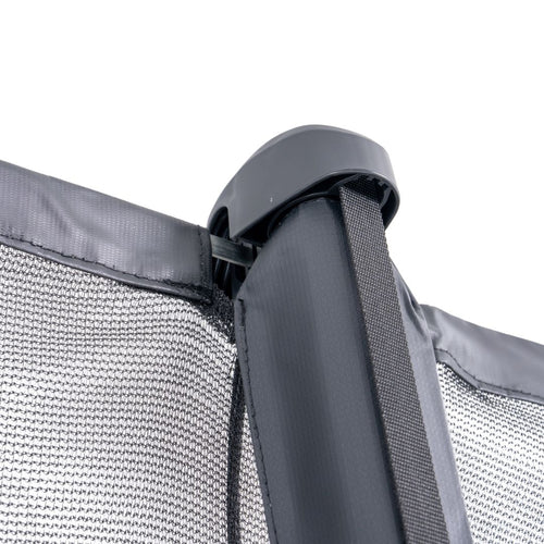 Close-up of a black metal pole supporting a mesh safety net with fabric trim, secured by a plastic cap and fastened with a strap—highlighting the advanced safety features that set the TP 10ft Infinity Round Trampoline by TP Toys apart.