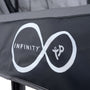 Close-up of a black panel from the TP Infinity 10ft x 14ft Rectangular Trampoline by TP Toys, showing a white infinity symbol with "INFINITY" inside and a stylized tp logo, designed for Olympic-level trampolining.