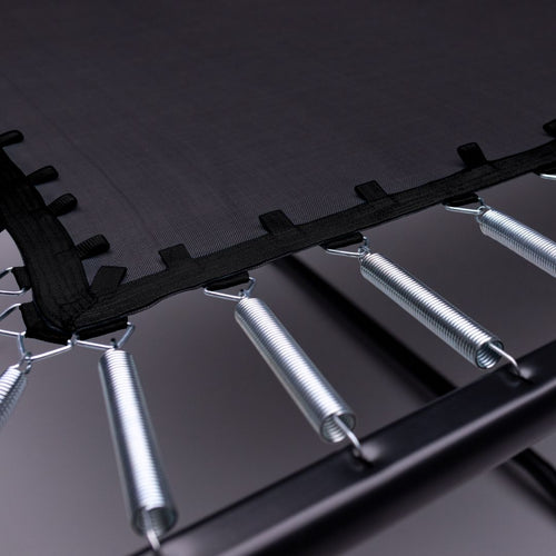 Close-up of the TP Infinity 10ft x 14ft Rectangular Trampoline by TP Toys, showing the black jumping mat attached to metal springs and a sturdy black frame designed for easy assembly.