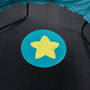 A yellow star inside a blue circle appears on the black mesh surface of the TP Toys Bluey UP 4.5ft Junior Trampoline, which features a teal edge.