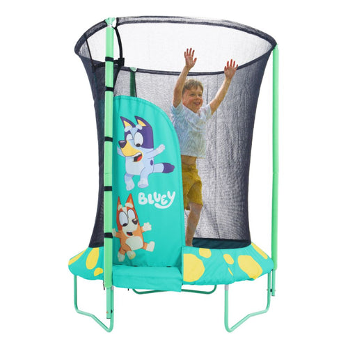 A child jumps inside the TP Toys Bluey UP 4.5ft Junior Trampoline, featuring Bluey characters and a black safety net with zip-free entry.
