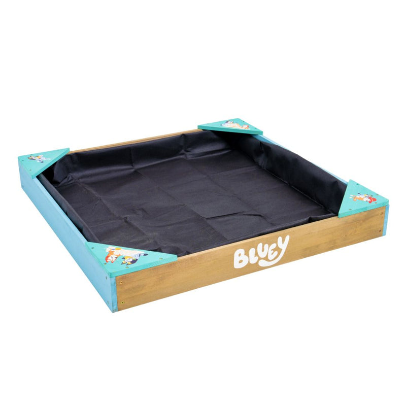 The TP Toys Bluey Wooden Sandpit with Cover features a sturdy frame, blue corner accents, and a black fabric base—ideal for hours of creative play.