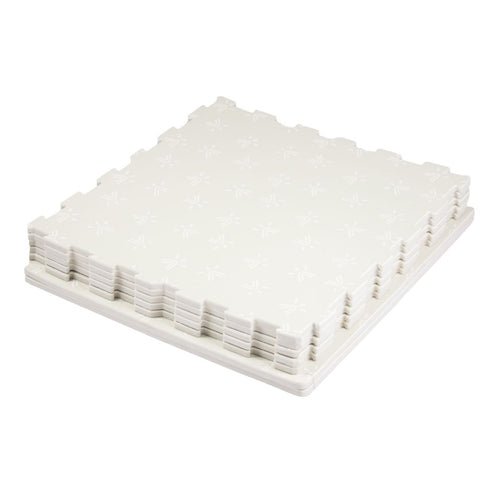 The TP Active-Tots Safety Play Mats by TP Toys are interlocking, non-toxic foam floor tiles with a subtle pattern—perfect for creating a safe and stylish toddler play area.