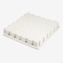 Neatly arranged on a white surface, the TP Active-Tots Safety Play Mats from TP Toys feature interlocking white foam tiles with a subtle pattern, offering a comfortable and safe foundation for active little ones.
