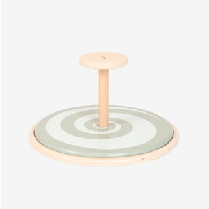 The TP Toys TP Active-Tots Pikler Style Wooden Spinning Seat - FSC® certified features a painted wooden construction with a central handle and a circular base adorned with concentric rings on a light background, making it an ideal Montessori-inspired toddler toy to encourage sensory play.
