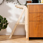 TP Active-Tots Pikler Style Wooden Helper Tower with a platform and handrail positioned against a kitchen cabinet.