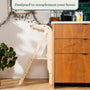 A TP Active-Tots Pikler Style Wooden Helper Tower standing against a kitchen counter, designed to complement your home.