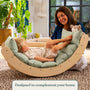 A young child lounges on the TP Toys Active-Tots Sway Wooden Rocker with Cushion (FSC® certified), while a smiling adult sits nearby holding a stuffed animal, in a bright, modern living room.
