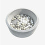 The TP Toys Active Tots Foam Ball Pit with 100 Playballs, featuring a round gray foam design filled with assorted white, beige, and gray plastic balls, provides an ideal space for sensory play and supports early childhood development—all showcased against a plain white background.