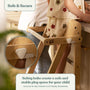 A child stands on the TP Toys Active-Tots Pikler Style Wooden Folding Helper Tower—FSC® certified and secured with safety bolts—while an adult holds their arm by the kitchen counter. Text highlights compliance with EU safety standards.