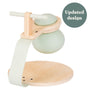 The TP Toys TP Active-Tots Pikler Style Toddler Bouncer – FSC® certified features a green rubber dome, a curved wooden platform, and a sturdy handlebar. Ideal for indoor active play. A green circle in the corner highlights its updated design.