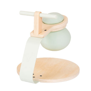 The TP Active-Tots Pikler Style Toddler Bouncer by TP Toys is an FSC® certified wooden bouncer, featuring a light green handle and base, with a rounded body and flat circular platform—perfect for adding fun to any nursery or indoor play space.