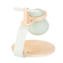 The TP Active-Tots Pikler Style Toddler Bouncer by TP Toys is an FSC® certified wooden bouncer, featuring a light green handle and base, with a rounded body and flat circular platform—perfect for adding fun to any nursery or indoor play space.
