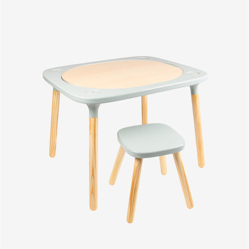 The TP Toys TP Active-Tots Pikler Style 4 in 1 Wooden Play Table with Play Stool—crafted from FSC® certified wood—features gently rounded corners, a matching stool, light wood legs, and soft pale grey accents. Set against a plain white background, this Montessori-inspired kids’ furniture is the ideal modern addition to any playroom.