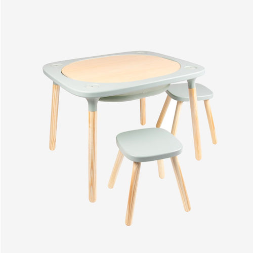 The TP Toys TP Active-Tots Pikler Style 4 in 1 Wooden Play Table with Two Play Stools, crafted from FSC® certified wood and featuring rounded corners, light wood legs, and light gray surfaces, is a Montessori-inspired set—perfect kids’ furniture for any playroom or learning space.