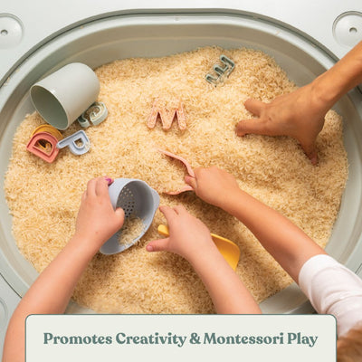 Children’s hands explore rice and letter-shaped toys with cups and scoops in the TP Toys Active-Tots Pikler Style 4 in 1 Wooden Play Table (FSC® certified). Text: Promotes Creativity & Montessori Play.
