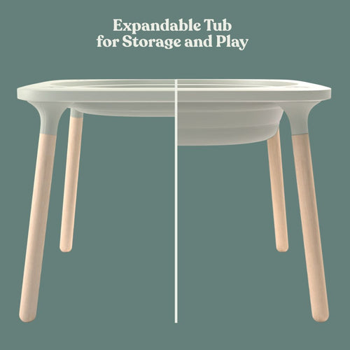 The TP Toys TP Active-Tots Pikler Style 4 in 1 Wooden Play Table - FSC® certified features light wooden legs and a white expandable tub, shown collapsed and expanded on a green background with "Expandable Tub for Storage and Play.