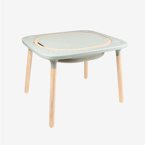 The TP Toys Active-Tots Pikler Style 4 in 1 Wooden Play Table—crafted with light wood legs, a light gray top, and a textured central surface—is an FSC® certified square Montessori activity table, making it an ideal piece of kids’ furniture for creative play and learning.