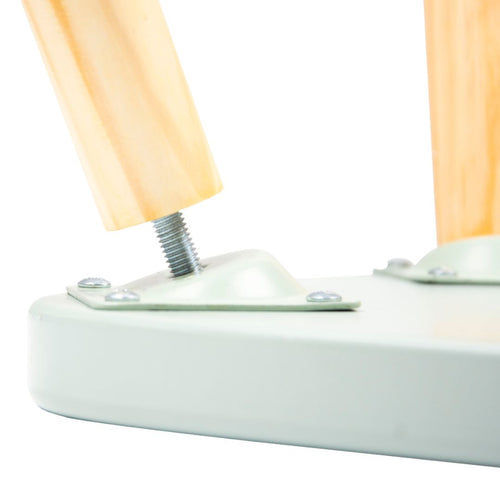 Close-up of a TP Toys Active-Tots Pikler Style Wooden Stool leg, FSC® certified, being attached to the white base with a metal screw and mounting plate for secure, child-safe assembly.