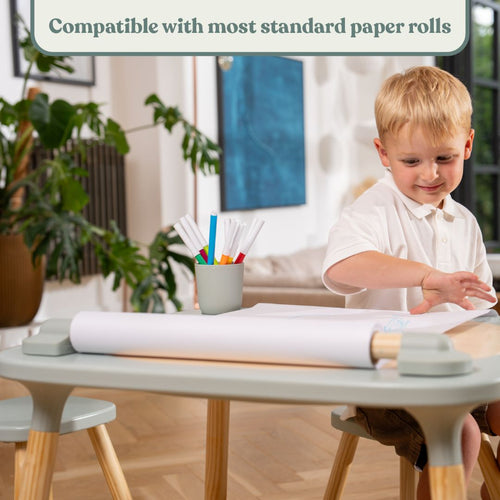 A child draws on a paper roll attached to the TP Active-Tots Play Table Paper Roll Accessory, which fits onto a small table.