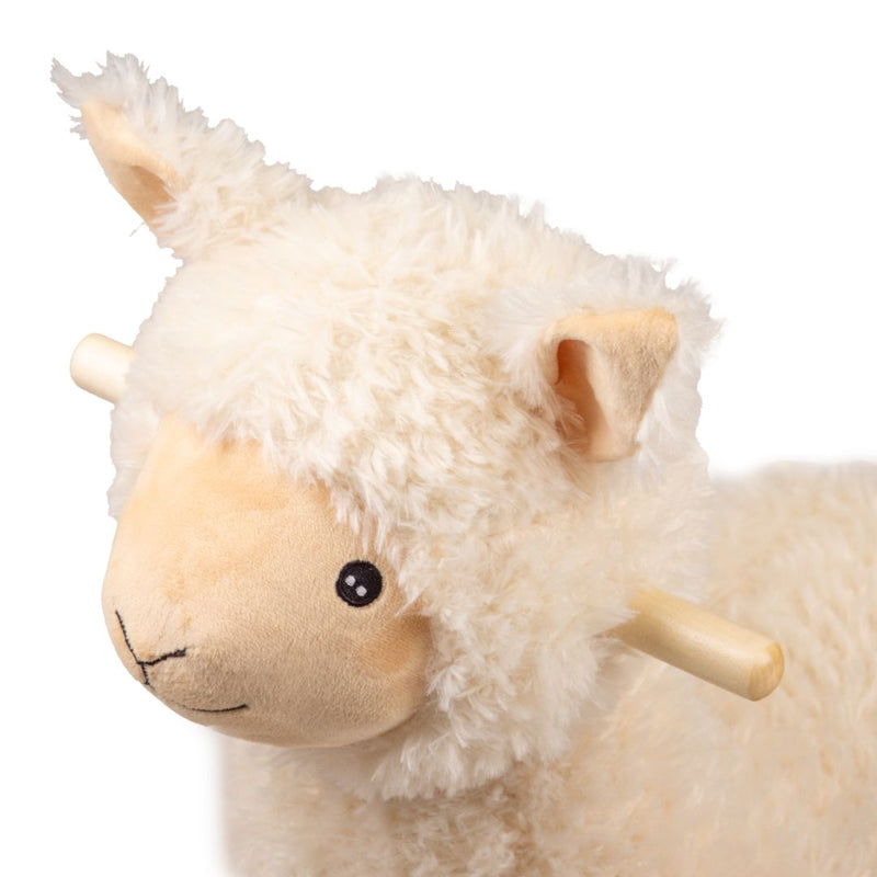 The TP Toys Active-Tots Rocking Llama features plush ivory fur, a tan face, round black eyes, and sturdy wooden handles on each side, displayed against a white background.