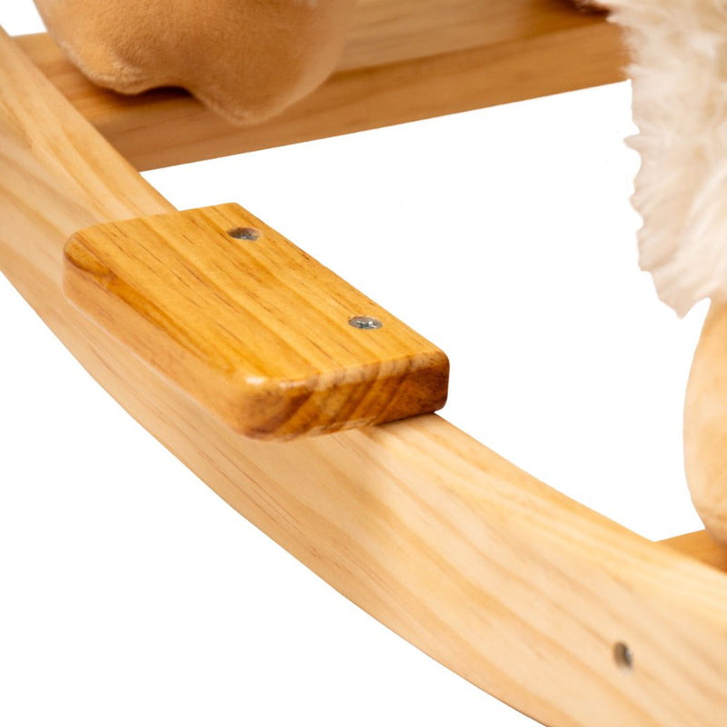 Close-up of a wooden rocking base with a rectangular footrest and plush details at the edge, showcasing the charming TP Toys Active-Tots Rocking Llama.