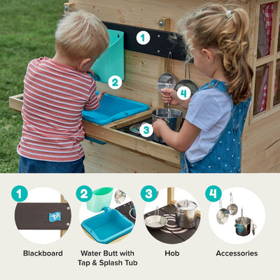 Two children play at the TP Toys TP Deluxe Mud Kitchen Playhouse Accessory—an FSC® certified outdoor wooden set featuring a blackboard, water butt with tap, splash tub, hob, and hanging pots for creative fun.