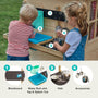 Two children play at the TP Toys TP Deluxe Mud Kitchen Playhouse Accessory—an FSC® certified outdoor wooden set featuring a blackboard, water butt with tap, splash tub, hob, and hanging pots for creative fun.