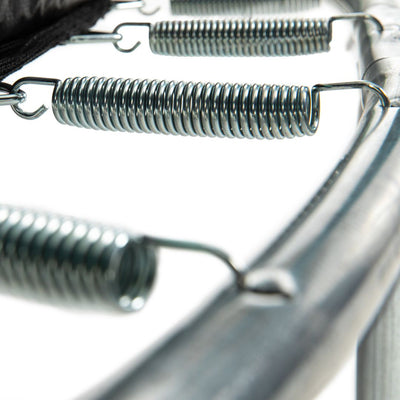 Close-up of metal springs secured to a circular frame from the TP UP 6ft Trampoline by TP Toys, showcasing sturdy construction and safety features against a white background.