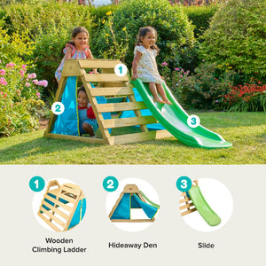 Two children play on the TP Toys TP Wooden Toddler Climb & Slide - FSC® certified, featuring a fabric-covered hideaway den, set up in a garden filled with flowers and grass.