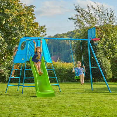 Three children play on the TP Explorer Metal Climbing Frame Set with Ripple Slide & Basketball Hoop by TP Toys, featuring swings and a ladder, on a grassy lawn with trees in the background.