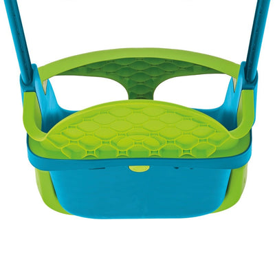 A close-up of the TP Toys Small to Tall 2 in 1 Metal Swing Set with Quadpod shows the blue and green seat with honeycomb backrest and safety bar. This adjustable swing set grows with your child for years of fun.