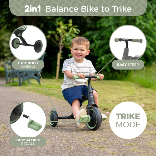 A young boy rides the Zoomee Balance Bike to Trike by TP Toys in trike mode outdoors, showcasing its extended wheels, easy-attach pedals, and smooth steering—ideal for supporting child development.