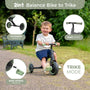 A young boy rides the Zoomee Balance Bike to Trike by TP Toys in trike mode outdoors, showcasing its extended wheels, easy-attach pedals, and smooth steering—ideal for supporting child development.