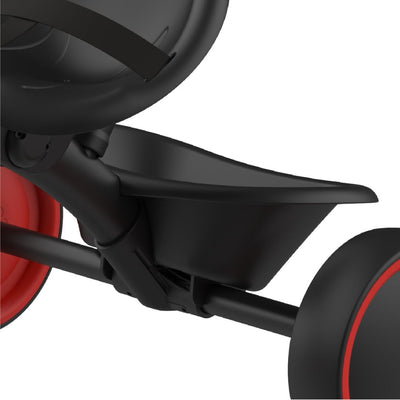 Close-up of the Zoomee 2 in 1 Trike – Firecracker by TP Toys features a black plastic seat, red wheels, and visible frame and pedals—ideal for a child’s first trike adventure on a white background.