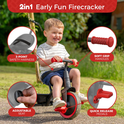 A young child enjoys the Zoomee 2 in 1 Trike – Firecracker by TP Toys outdoors, featuring a 3-point safety harness, soft grip handles, adjustable seat, and quick-release pedals.