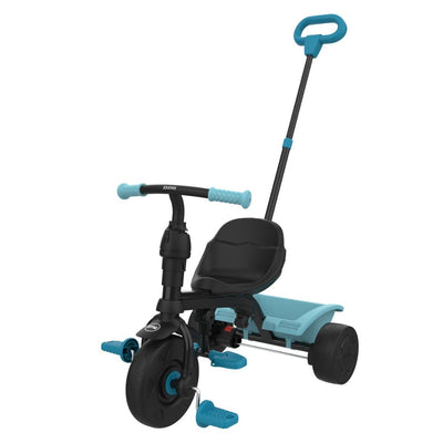 The TP Toys Zoomee 4 in 1 Trike - Dino Discovery is a blue and black childrens trike with a rear push handle, foot pedals, adjustable UV sunshade, and a storage compartment behind the seat.